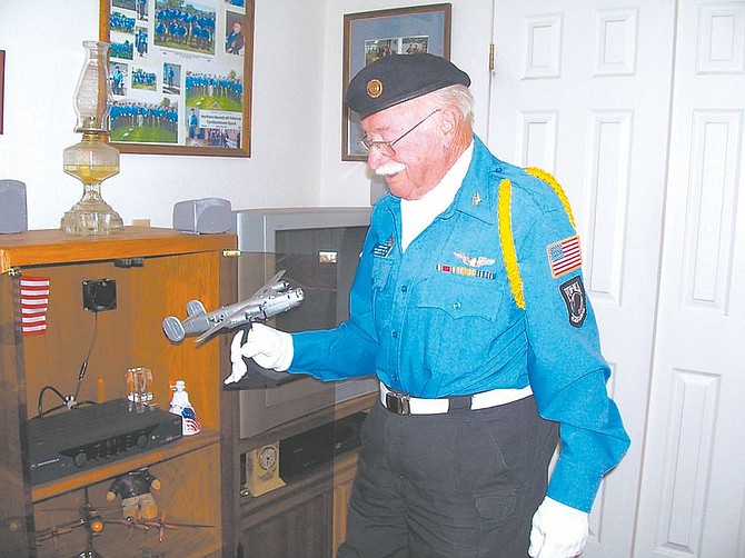 Karen Woodmansee/Nevada AppealAmerican Legion Post #56&#039;s oldest member, Stephen Hays, 86, looks at a model of the B24 plane he flew over the South Pacific during World War II on Saturday. Hays, along with other members of the post&#039;s honor guard, will lead the Virginia City Veteran&#039;s Day Parade at 11 a.m. Tuesday.