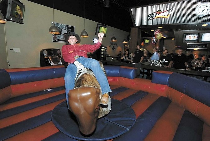 BRAD HORN/Nevada AppeBarney Pearsall, of Silver Springs, rides a mechanical bull at Sparky&#039;s Roadhouse in Carson City on Friday night.