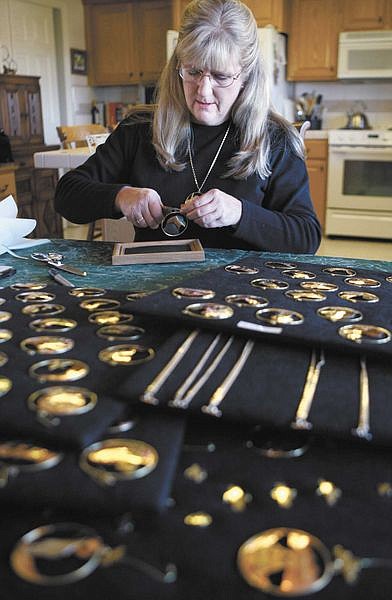 Cathleen Allison/Nevada AppealWendy Talbott works on framing an ornament Tuesday at her North Carson City home. Talbott is one of more than 100 crafters who will participate in this weekend&#039;s 14th annual Holiday Craft Fair at Carson High School.