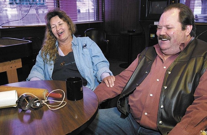 Cathleen Allison/Nevada AppealMustang Sallie and Greg &quot;Smack Dog&quot; Hendricks joke Wednesday about their upcoming Biscuits and Gravy Throwdown. The challenge, being held at Crossroads Bar, will benefit the Carson City Raiders Booster Club, which gives gifts to seniors during the holidays.