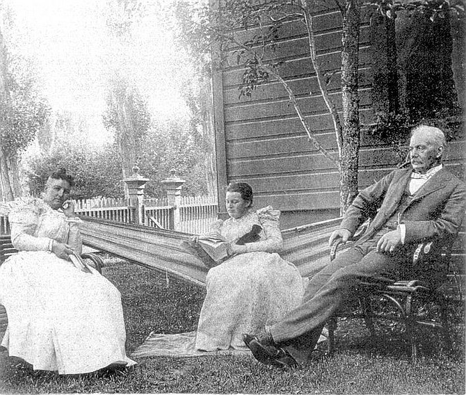 Courtesy of the R. K. Colcord CollectionGov.  Roswell Colcord sits at home on a summer afternoon with his wife, Mary, left, and daughter, Stella.