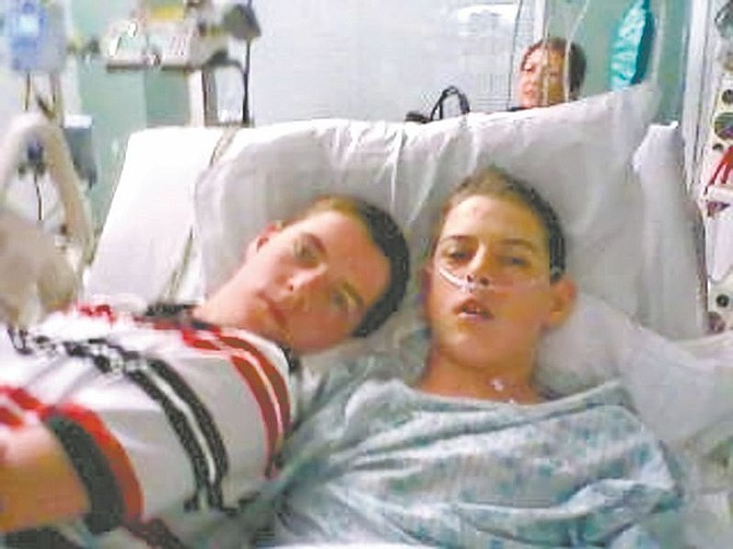 Submitted PhotoJames Patterson, right, rests with his twin brother, Jacob, in a Salt Lake City hospital.