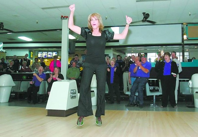 BRAD HORN/Nevada Appeal Nevada First Lady Dawn Gibbons reacts after knocking down seven pins during opening ceremonies of the Nevada State Bowling Championships at Carson Lanes on Friday.