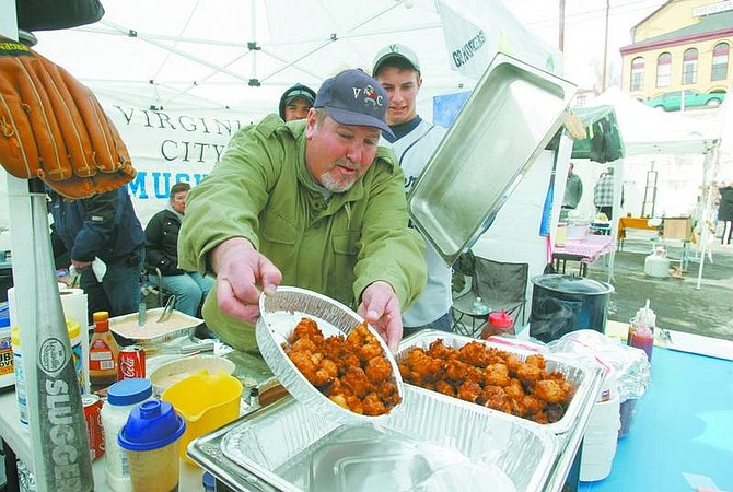 Photos by BRAD HORN/Nevada Appeal Bill Craig pours deep-fried oysters into a serving tray at the annual Mountain Oyster Festival and St. Patrick&#039;s Day parade on Saturday. Top, Brian O&#039;Connell, of Carson City, serves in the American Legion Post 56 honor guard, and participated in the parade in Virginia City.