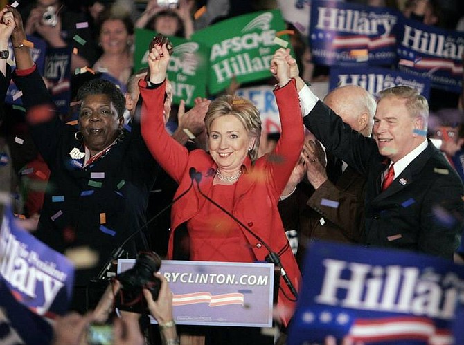 Mark Duncan/Associated Press Democratic presidential hopeful Sen. Hillary Rodham Clinton, D-N.Y., acknowledges supporters during a primary night rally Tuesday in Columbus, Ohio. Clinton is the projected winner of the Ohio primary. Standing with Clinton are Rep. Stephanie Tubbs Jones, D-Ohio, and Ohio Gov. Ted Strickland.