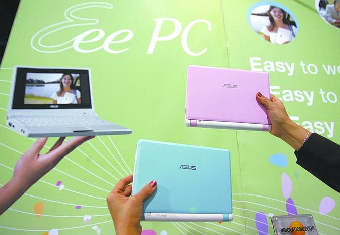 Paul Sakuma/Associated Press Different color ASUS Eee PC notebooks are seen on display at the ASUS booth at the Consumer Electronics Show (CES) in Las Vegas on Wednesday.