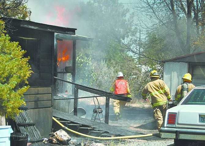 Cathleen Allison/Nevada AppealA Carson City man&#039;s home was destroyed by fire Wednesday on Bel Aire Way. Investigators believe the fire was possibly started when the hot-water heater exploded.