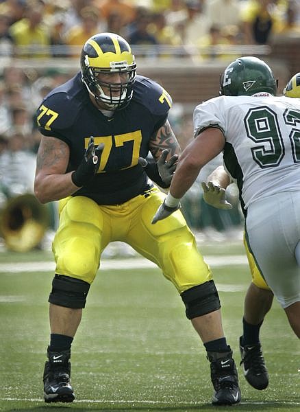 University of Michigan offensive lineman Jake Long (77) goes up against Eastern Michigan defensive lineman Eric Young during a football game at Michigan Stadium in Ann Arbor, Mich., Saturday, Oct. 6, 2007. If the Miami Dolphins make Long the top selection in the 2008 draft he will be the first offensive lineman, and fifth in league history, to be the No. 1 pick since 1997, when the St. Louis Rams took Ohio State tackle Orlando Pace. (AP Photo/Carlos Osorio)