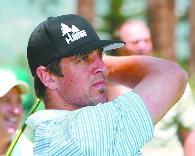 Jim Grant / Tahoe Daily Tribune Aaron Rodgers eyes his tee shot on the eighth hole during a practice round on Wednesday.
