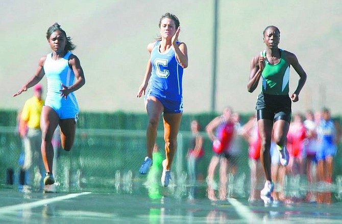 BRAD HORN/Nevada Appeal Carson&#039;s Kayla Sanchez, center, placed second in the 100 meter finals at the Nevada State Track and Field Championships at Damonte Ranch High School Friday.