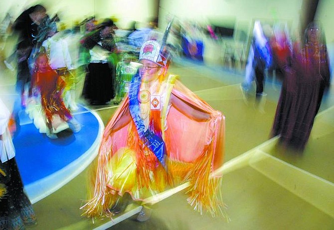 BRAD HORN/Nevada Appeal Sierra Wyatt, the reigning Numaga Indian Days Junior Princess, 11, of Reno, dances during the Mother Earth Awakening Social Pow Wow at the Indian Colony Gym on Curry Street on Saturday.