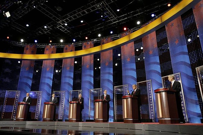 Alex Brandon/Associated Press Republican presidential hopefuls, former Sen. Fred Thompson, R-Tenn., former Mass. Gov. Mitt Romney, Sen. John McCain, R-Ariz., former Arkansas Gov. Mike Huckabee, former New York City Mayor Rudy Giuliani, and Rep. Ron Paul, R-Texas, stand on stage during the Fox News Channel Republican presidential debate in Myrtle Beach, S.C., on Thursday.