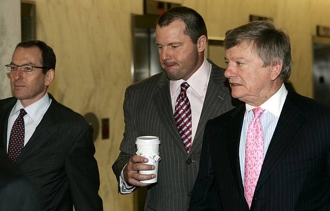 AP Photo/Evan VucciFormer New York Yankees pitcher Roger Clemens, center, accompanied by his attorneys Rusty Hardin, right, and Lanny Breuer, left, arrives on Capitol Hill in Washington on Tuesday  for his deposition before the House Oversight and Government Reform Committee that is investigating steroids and HGH use in professional baseball.