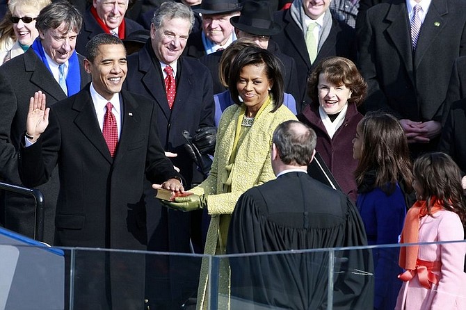 Barack H. Obama is sworn in by Chief Justice John Roberts as the 44th President of the United States of America on the West Front of the Capitol Tuesday, Jan. 20, 2009 in Washington.  Obama&#039;s wife Michelle holds the Bible.  (AP Photo/Mark Wilson, Pool)