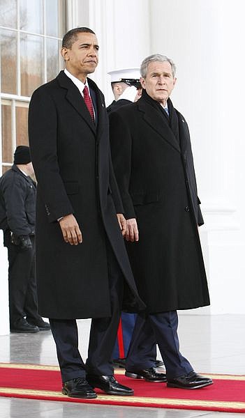 President Bush, right, walks out with President-elect Barack Obama, left, on the North Portico of the White House before sharing the Presidential limousine enroute to Capitol Hill for the inauguration of the President-elect in Washington, Tuesday, Jan. 20, 2009. (AP Photo/Pablo Martinez Monsivais)