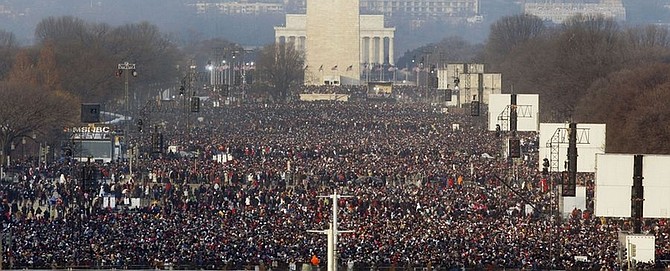 Crowds gather on the National Mall in Washington for the swearing-in ceremony of President-elect Barack Obama on Tuesday, Jan. 20, 2009. (AP Photo/Ron Edmonds)