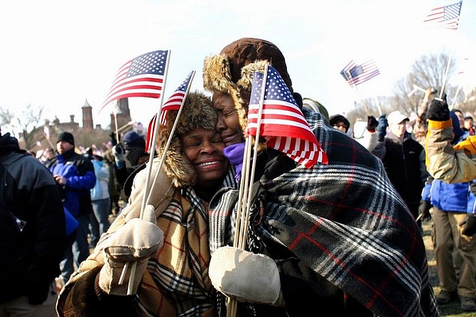 Rochelle Bias, right, hugs her sister Lorraine as the two are overcome with emotion after President Obama is sworn in on Tuesday. Illustrates OBAMA-TIMES (category w), Los Angeles Times, (c) 2009. Moved Tuesday, Jan. 20, 2009. (MUST CREDIT: Los Angeles Times photo by Jay L. Clendenin.)