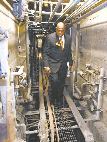 Assemblyman Wiliam Horne, D- Las Vegas, looks at antiquated plumbing at the Nevada State Prison on Thursday, Feb. 5, 2009, in Carson City, Nev. Assembly Judiciary Committee members toured the aging facility in advance of next weeks&#039; hearing on issues facing the state prison system. (AP Photo/Nevada Appeal, Cathleen Allison)