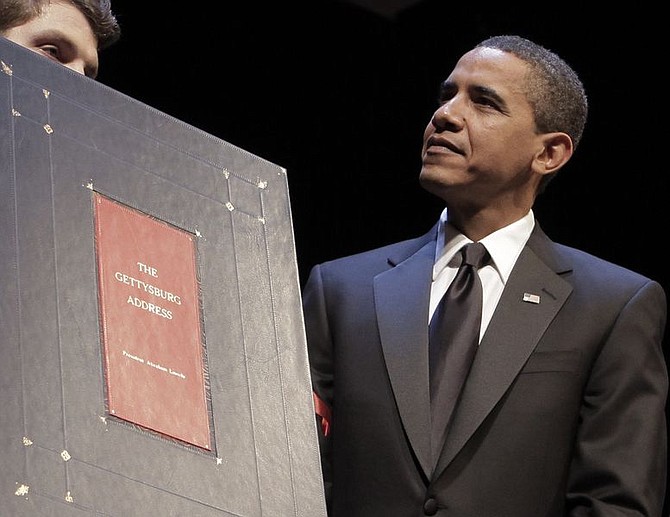 President Barack Obama is presented with a replica of the Gettysburg Address during a visit to Ford&#039;s Theater to mark the Abraham Lincoln bicentennial Wednesday, Feb. 11, 2009 in Washington.  (AP Photo/Evan Vucci)
