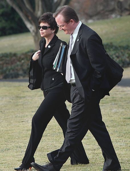 ** ADVANCE FOR SUNDAY, FEB. 15, AND THEREAFTER - FILE ** In this Feb. 10, 2009, file photo White House Press Secretary Robert Gibbs, right, and Senior Adviser Valerie Jarrett walk to board Marine One at the White House in Washington. Both Jarrett and Gibbs worked on the presidential campaign of President Barack Obama, and followed him  into the White House and some of the most coveted office space on the planet in the West Wing, where proximity to power trumps square footage, postcard views and modern amenities.  (AP Photo/Ron Edmonds)