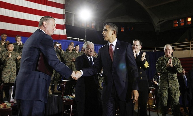 President Barack Obama shakes hands with National Security Adviser James Jones after he spoke about combat troop levels in Iraq as he addresses military personnel at Marine Corps Base Camp Lejeune, N.C., Friday, Feb. 27, 2009. At rear are Defense Secretary Robert Gates, Chairman of the Joint Chiefs of Staff Adm. Mike Mullen, and Lt. Gen. Dennis Hejilik, Commanding General, Second Marine Expeditionary Force, Camp Lejeune.  (AP Photo/Charles Dharapak)