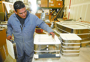 Shannon Litz/Nevada Appeal News ServicePablo Villanueva explains the different parts of the kiln Feb. 19 at AIM Kilns in Johnson Lane. The company recently relocated to Nevada from Oregon.