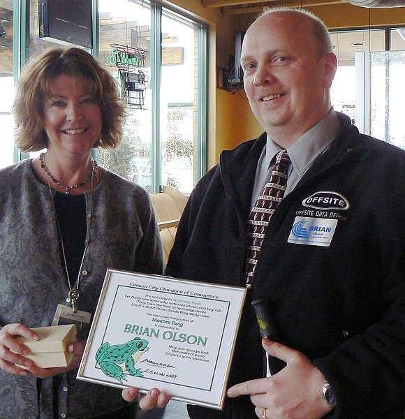 Photo providedCheri Glockner, left, presents Brian Olson, owner of Offsite Data Depot, with an award from the Carson City Chamber of Commerce recognizing him as the top networker.