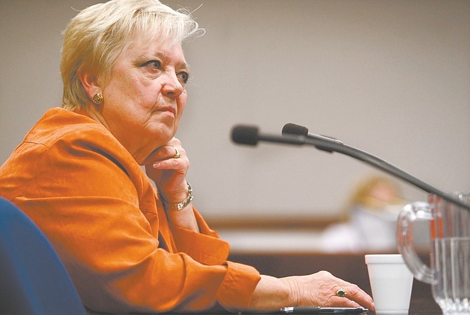 Nevada Assemblywoman Kathy McClain, D-Las Vegas, listens to discussion in a hearing Wednesday, March 11, 2009, at the Legislature in Carson City, Nev. McClain introduced a measure that would create a statewide registry to keep track of people who abuse and neglect the elderly. (AP Photo/Nevada Appeal, Cathleen Allison)