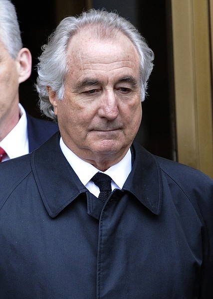 Bernard Madoff exits Manhattan federal court in New York on Tuesday, March 10, 2009. Madoff will plead guilty Thursday to 11 felony counts including money laundering, perjury and securities fraud that carry a potential prison term of 150 years, his lawyer and prosecutors said Tuesday. (AP Photo/Louis Lanzano)