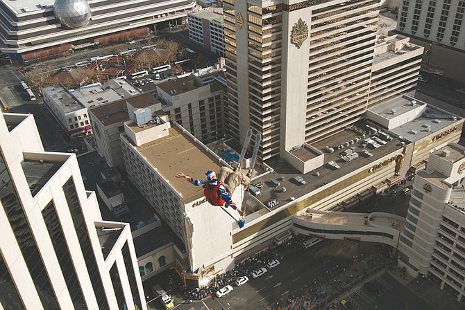 In this photo provided by the Reno Sparks Convention and Visitor&#039;s Authority, Shane McConkey, a long time star of ski action movies who pioneered ski BASE jumping off giant cliffs in Europe, makes history as he performs the first-ever urban Ski-BASE jump off the roof of the Silver Legacy hotel casino in downtown Reno, Nev., Saturday Nov. 17, 2007. The stunt was to promote the local premier of the 2007 Warren Miller ski movie Playground and to raise money for the Make-a-Wish foundation, which helps make wishes come true for seriously ill children.(AP Photo/Reno Sparks Convention and Visitor&#039;s Authority, ho)