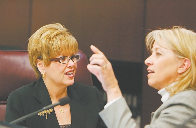 Sen Shirley Breeden, D-Henderson, left, talks to Sen. Minority Whip Barbara Cegavske, R-Las Vegas, before a committee meeting at the Nevada Legislature in Carson City, Nev., on Friday, March 27, 2009.