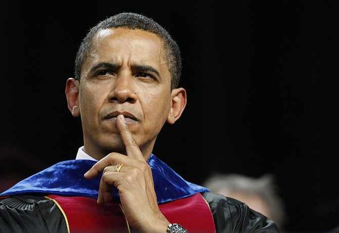 President Barack Obama listens as he is introduced before speaking at the Arizona State University commencement ceremony at Sun Devil Stadium in Tempe, Ariz., Wednesday, May 13, 2009. (AP Photo/Charles Dharapak)