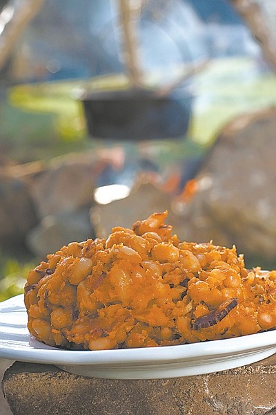 **FOR USE WITH AP LIFESTYLES** Campfire pork and beans are seen in this Sunday April 19, 2009 photo. A simple wood campfire provides both ambience and a great cooking venue for these Campfire Pork and Beans. (AP Photo/Larry Crowe)