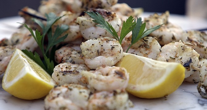 **FOR USE WITH AP LIFESTYLES** This photo taken April 27, 2009 shows that adding fennel seeds and thyme to  shrimp can make a barbecue shrimp kabob tasty and good for you in this dish seen ready to serve.(AP Photo/Jim Cole)