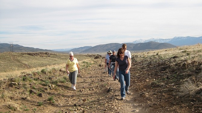 Submitted PhotoHikers walk along one of the network of trails in the hills behind Centennial Park.