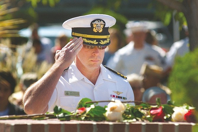 Commander Luther Hook pays his respects at Fallon&#039;s 9/11 Memorial during Fallon&#039;s 9/11 observance Thursday morning.