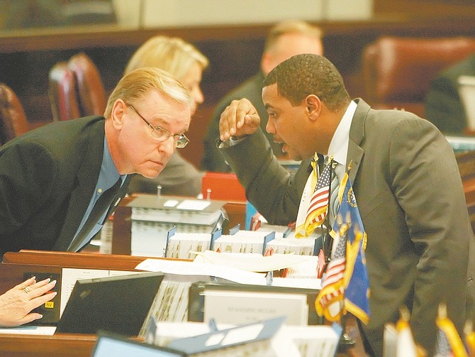 Nevada Sen. David Parks, D-Las Vegas, left, and Senate Majority Leader Steven Horsford, D-Las Vegas, speak in the Senate Chambers on Saturday.