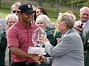 Jack Nicklaus, right, presents the trophy to Tiger Woods after Woods won the Memorial golf tournament Sunday, June 7, 2009 in Dublin, Ohio. Woods finished at 12-under 276 and won for the 67th time in his career.  (AP Photo/Mike Munden)