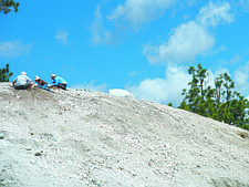 Diggers seek quartz pieces at the top of the mound of quartz and rock at the Crystal Mine near Verdi.
