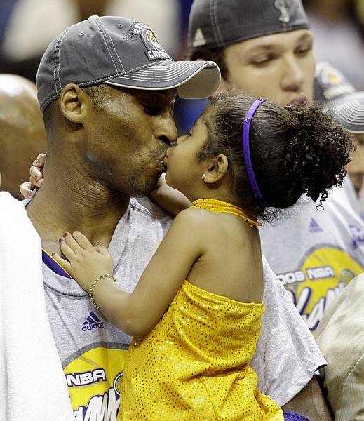 Los Angeles Lakers&#039; Kobe Bryant kisses his daughter, Gianna, after beating the Orlando Magic 99-86 in Game 5 to win the NBA basketball finals Sunday, June 14, 2009, in Orlando, Fla. (AP Photo/David J. Phillip)