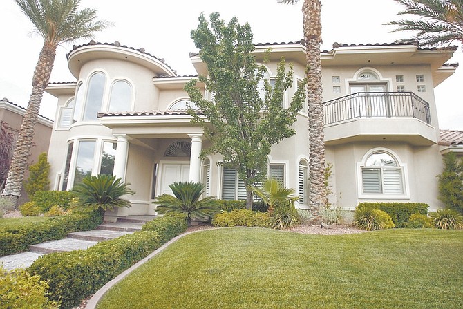 This photo taken June 16, 2009 shows the home of Doug and Cindy Hampton in Las Vegas. Cindy Hampton, a former campaign aide to Sen. John Ensign confirmed her involvement Wednesday in an extramarital affair with the conservative Republican, lamented his decision to &quot;air this very personal matter&quot; and said she eventually would tell her side of the story. (AP Photo/Isaac Brekken)