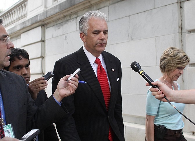 Sen. John Ensign, R-Nev. is seen talking with reporters on his way to a vote on Monday, June 22, 2009 on Capitol Hill in Washington. (AP Photo/Lauren Victoria Burke)