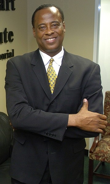 In this July 7, 2006 photo, Dr. Conrad Murray poses for a photo as he opens the Acres Homes Cardiovascular Center at the Tidwell Professional Building, in Houston. A woman who answered the phone Friday, June 26, 2009, at Dr. Conrad C. Murray&#039;s clinic in Houston confirmed to The Associated Press that Murray was Michael Jackson&#039;s cardiologist. Los Angeles police say they want to speak to the doctor but stressed he was not under criminal investigation. (AP Photo/Houston Chronicle)