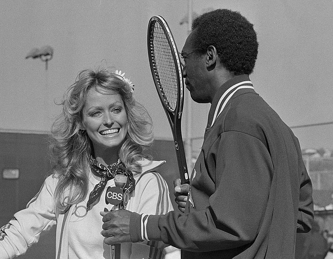 FILE - In this April 4, 1977 file photo, actress Farrah Fawcett and comedian Bill Cosby are shown at the Challenge of the Sexes tournament in Mission Viejo, Calif.  Fawcett died, Thursday, June 25, 2009, at a hospital in Los Angeles.  She was 62.  (AP Photo/Jeff Robbins, file)