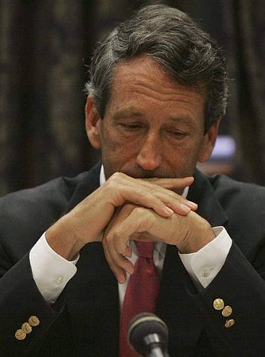 South Carolina Gov. Mark Sanford pauses after apologizing to his state agency chiefs for keeping them in the dark when he went to Argentina to see his mistress Friday, June 26, 2009, in Columbia, S.C. The Republican on Friday held his typical public meeting with the agency chiefs, but started with apologies and likening his confession and future to the biblical plight of King David. (AP Photo/Mary Ann Chastain)