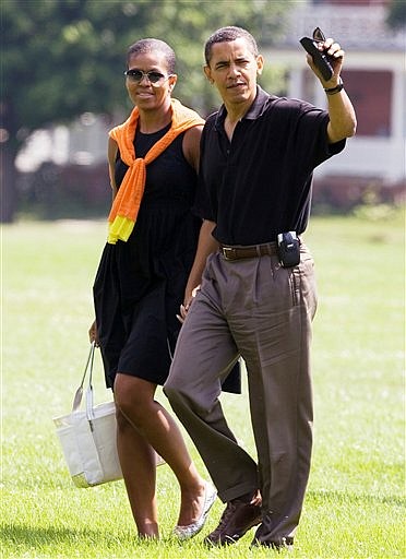 President Barack Obama and first lady Michelle Obama, arrive at Fort Lesley J. McNair from Camp David, Md., Saturday, July 4, 2009, in Washington. (AP Photo/Manuel Balce Ceneta)