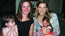 Sara Thompson/Nevada Appeal News ServiceKristin Mozzochi, right, sits with her newborn son, Alessandro, and her doula, Launa Martin. Martin became a doula after her daughter Miakoda, who is sitting in her lap, was born.