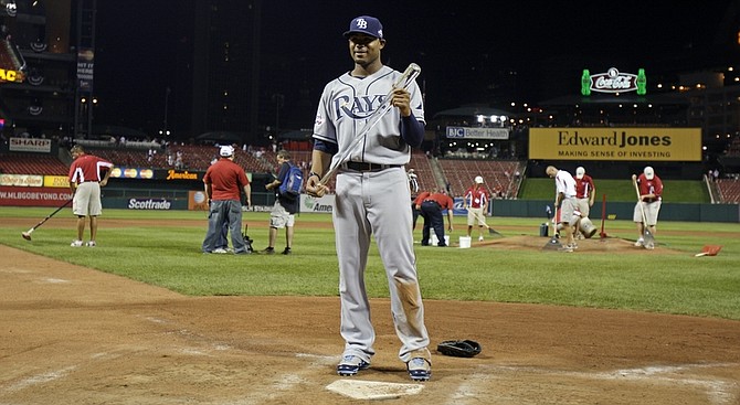 American League&#039;s Carl Crawford of the Tampa Bay Rays holds the MVP trophy after the American League defeated the National League 4-3 in the MLB All-Star baseball game in St. Louis, Tuesday, July 14, 2009. (AP Photo/Jeff Roberson)