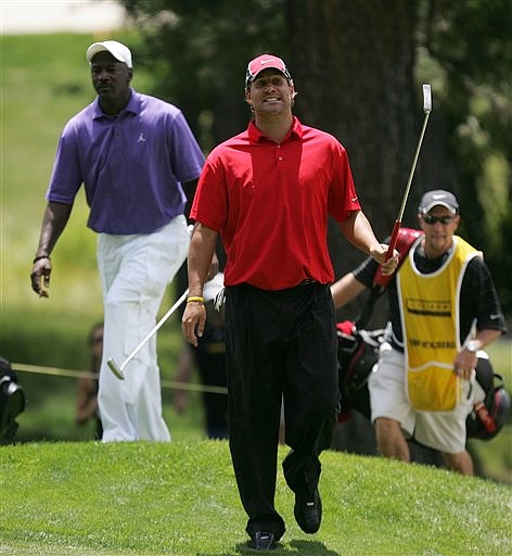 Pittsburgh Steelers quarterback Ben Roethlisberger, front walks onto the 12th green followed by former NBA star Michael Jordan, left,  during the American Century Golf Championship on Saturday, July 18, 2009, at Edgewood Tahoe Golf Course in Stateline, Nev. (AP Photo/Brad Horn)