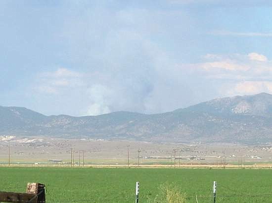 Kurt Hildebrand/Record-CourierSmoke is seen rising over the Pine Nut mountains Friday.